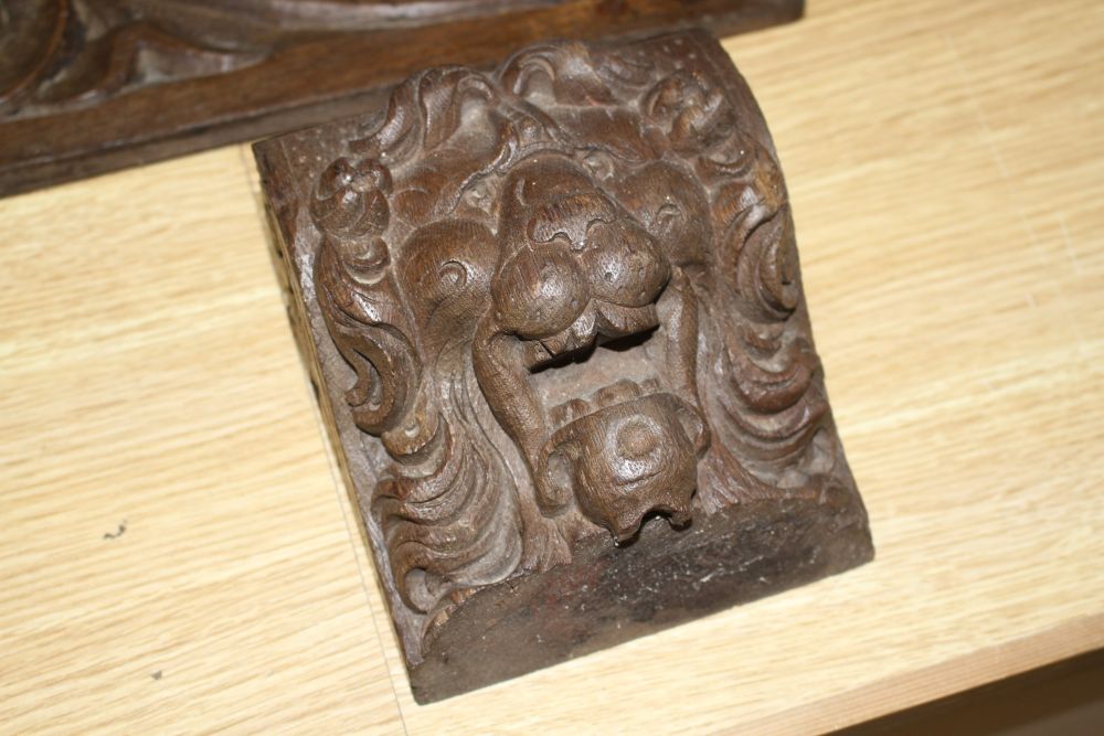 Three 19th century Continental carved oak corbels, carved with lion masks and a pair of scroll and dragon carved frieze panels